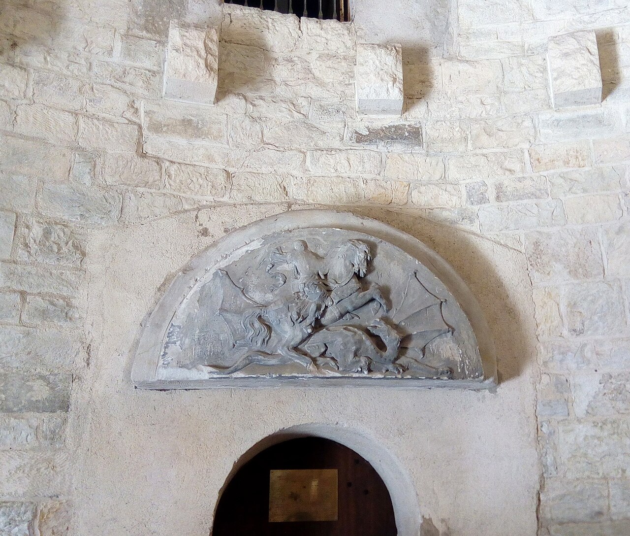 The relief above the door
